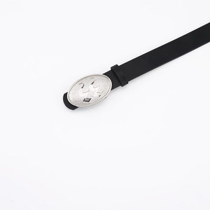 Detail of black leather belt with matte silver buckle featuring trident镂空 emblem