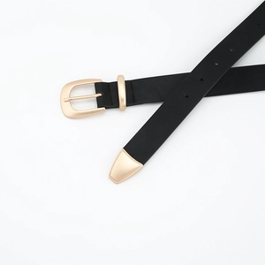 Minimalist black leather belt for women with gold horseshoe buckle and metal tip