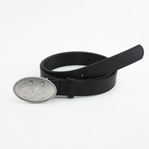 Detailed view of black leather belt featuring an oval silver buckle with geometric patterns