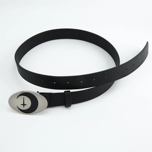 Detailed view of black leather belt with silver oval buckle featuring moon and star motifs