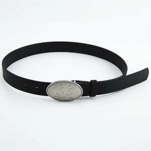 Detail of black leather belt with a matte silver oval buckle featuring embossed number 22