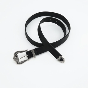 Vintage black leather belt for women featuring ornate carved metal buckle and tip in silver