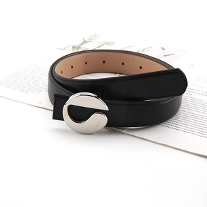 Minimalist black leather women's belt with a stylish silver irregular buckle on white background
