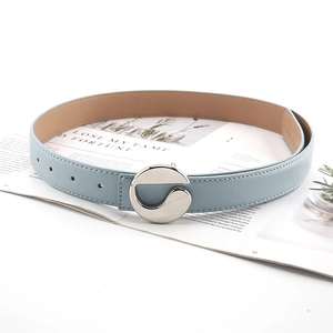 Close-up of women's light blue slim belt with a polished silver G-shaped metal buckle