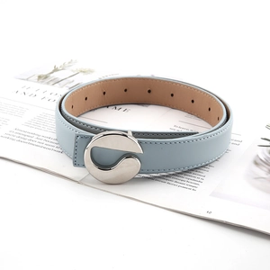 Minimalist light blue leather belt for jeans with stylish silver round metal buckle