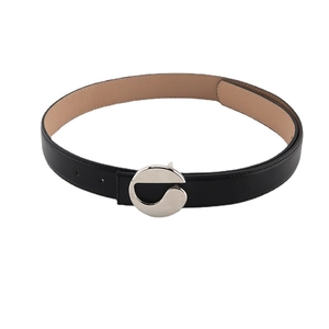 Minimalist black leather belt for jeans with a round silver geometric metal buckle