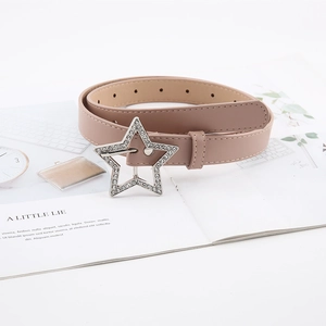 Detail of star-shaped rhinestone buckle on a soft brown faux leather belt for women