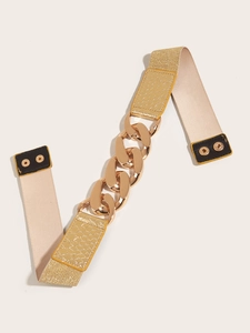 Elastic waist belt for women with large gold chain buckle and snake skin texture accents