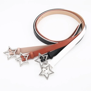 Detail showing various colors of slim belts with sparkling star-shaped rhinestone buckles