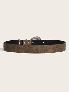 Detailed view of dark brown leather belt with embossed floral patterns and silver buckle