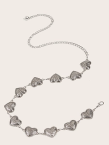 Detail of silver alloy waist chain featuring embossed heart links and lobster clasp