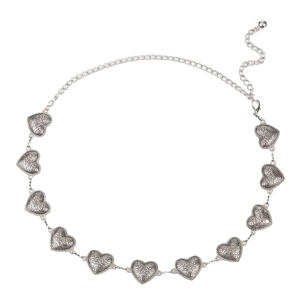 Light luxury retro silver heart chain belt with engraved floral patterns on white backdrop