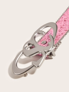 Detail of pink glitter belt with silver bead edges and stylish interlocking metal buckle