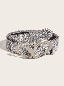 Detail view of silver sequin belt featuring a metallic bead trim and heart buckle