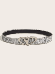 Detail of silver sequin belt with heart-shaped buckle and decorative SC letter design