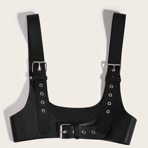 Close-up of black punk PU leather body harness with silver metal buckles and eyelets