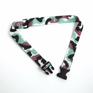 Close-up of camouflage nylon belt with durable black plastic buckle and adjustable strap