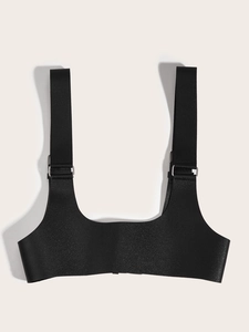 Gothic style black PU leather harness vest with silver metal buckles on white background
