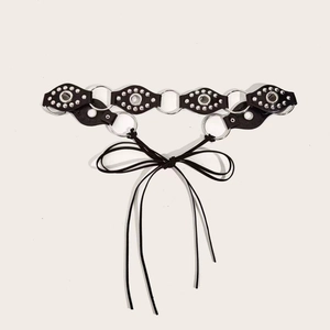 Retro punk style black faux leather belt with silver rivets and metal ring connecting links