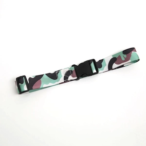 Detail of military camouflage nylon belt with high-strength black plastic buckle and slider