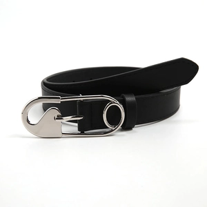 Minimalist black leather belt with a large silver safety pin buckle for jeans