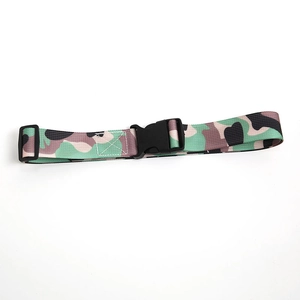 Detail of military camo nylon belt for students featuring black plastic quick release buckle
