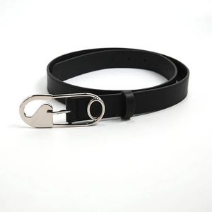 Close-up of black leather belt featuring a unique silver safety pin metal buckle design
