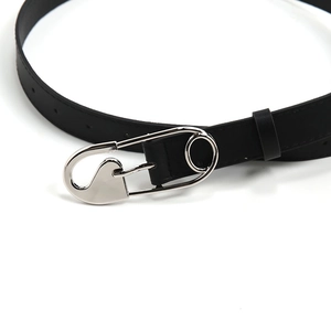 Close-up of black leather belt with a unique silver safety pin metal buckle design