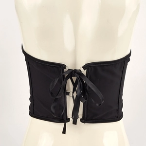 Chic black satin corset top featuring a lace-up back design and silver metal rings
