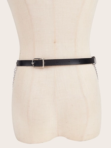 Detail of black punk waist belt with silver metal chains and lace for dresses