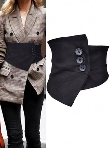 Detail of black asymmetric corset belt with three round buttons on textured fabric
