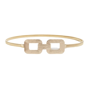 Elegant gold metal spring waist belt featuring textured interlocking double square buckles