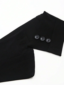Detail of black elastic corset belt showing three-button closure and knit fabric texture