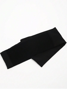 Close-up of black elastic corset belt showing high-stretch knit fabric and texture