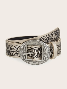 Detailed close-up of a vintage Y2K western belt featuring floral patterns and buckle