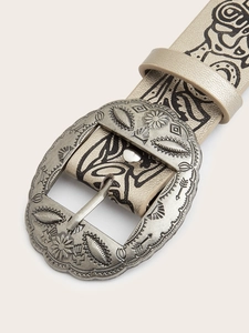 Detailed macro of vintage silver belt buckle with ethnic patterns on leather strap