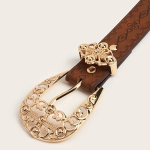 Vintage brown textured belt with an ornate golden engraved buckle and geometric patterns