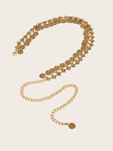 Detail of vintage gold coin waist chain belt with double row textured alloy relief design