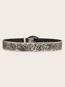 Close-up of vintage Y2K belt with floral embossing and metallic silver finish texture