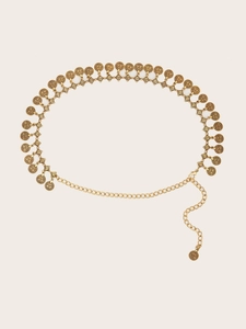 Detail of vintage gold metal waist chain featuring embossed coin charms and lobster clasp