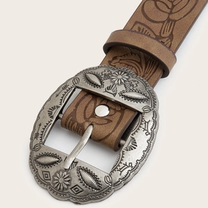Vintage Y2K brown leather belt with large ornate silver floral buckle for denim jeans