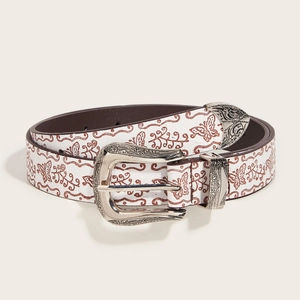 Brown vintage floral pattern belt with carved silver buckle on a neutral background