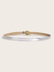 Detail of silver metallic belt with gold circular buckle and beige inner lining