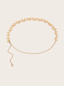 Detail of golden metal waist chain featuring textured butterfly charms and adjustable links