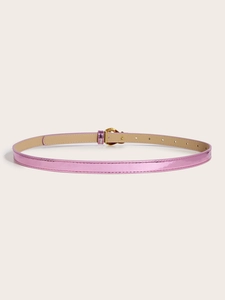 Detail view of pink patent leather slim belt with a polished gold oval metal buckle