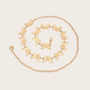 Elegant gold butterfly chain belt with textured relief details and adjustable clasp
