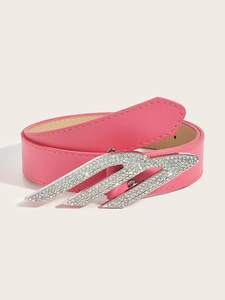 Close-up of pink faux leather belt with Y2K style silver rhinestone buckle details