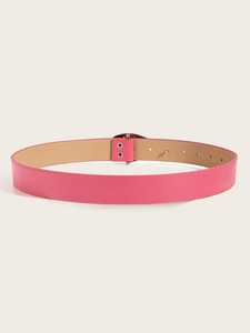 Detail view of pink PU leather belt featuring precise stitching and metal adjustment holes