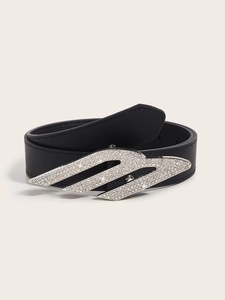 Detailed macro view of the Y2K vintage black leather belt with sparkling rhinestone D-buckle