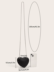 Detail view of heart-shaped mini leather crossbody bag with chain and size measurements